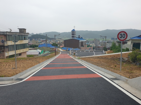 군사1리지구 주거환경 개선사업 순항(서천초등학교_아인빌라구간 도로 모습)